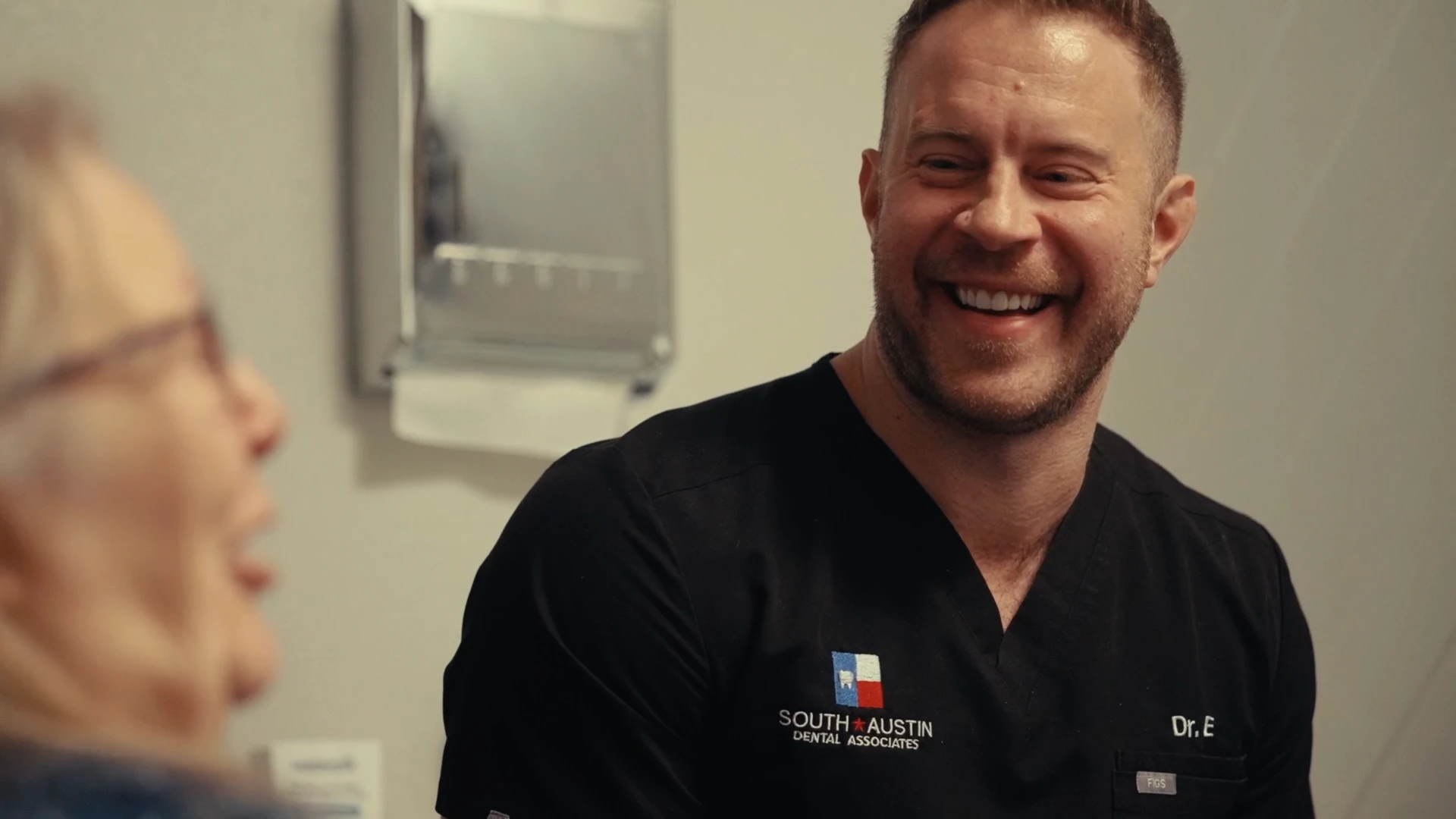 Dr. Evan Matthysse consulting a patient for affordable wisdom teeth removal in Austin, TX.